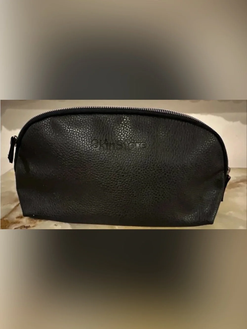 Skinstore pebbled vegan leather travel toiletry bag. Approx 12x6x3 inches